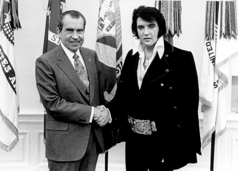FILE PHOTO: President Richard Nixon meets with Elvis Presley December 21, 1970 at the White House. (Photo by National Archives)