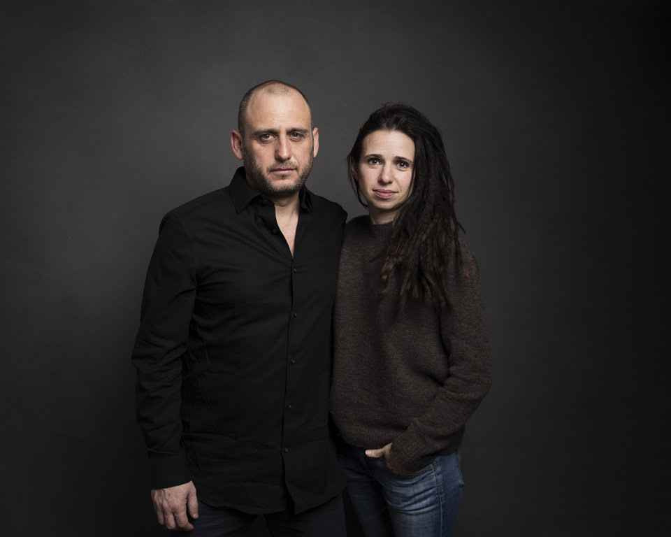 Directors Shaul Schwarz, left, and Christina Clusiau pose for a portrait to promote the film, "Trophy, at the Music Lodge during the Sundance Film Festival on Friday, Jan. 20, 2017, in Park City, Utah. (Photo by Taylor Jewell/Invision/AP)